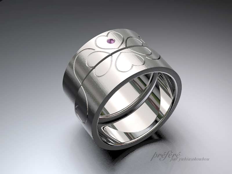 放射線状テクスチャー仕上げに四つ葉のクローバーをデザインした結婚指輪