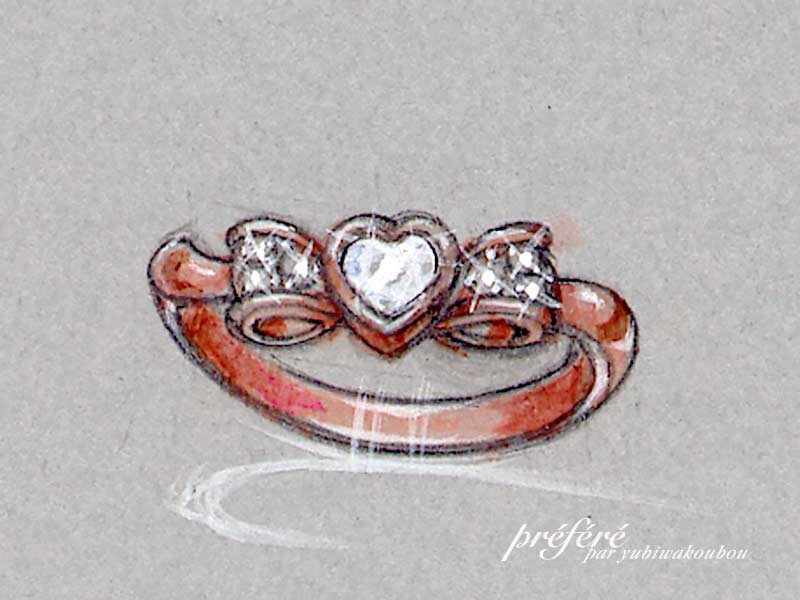 婚約指輪はオーダーメイドでハートダイヤのリボンデザインです。