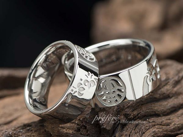 四つ葉のクローバーと家紋を入れた幅広の結婚指輪